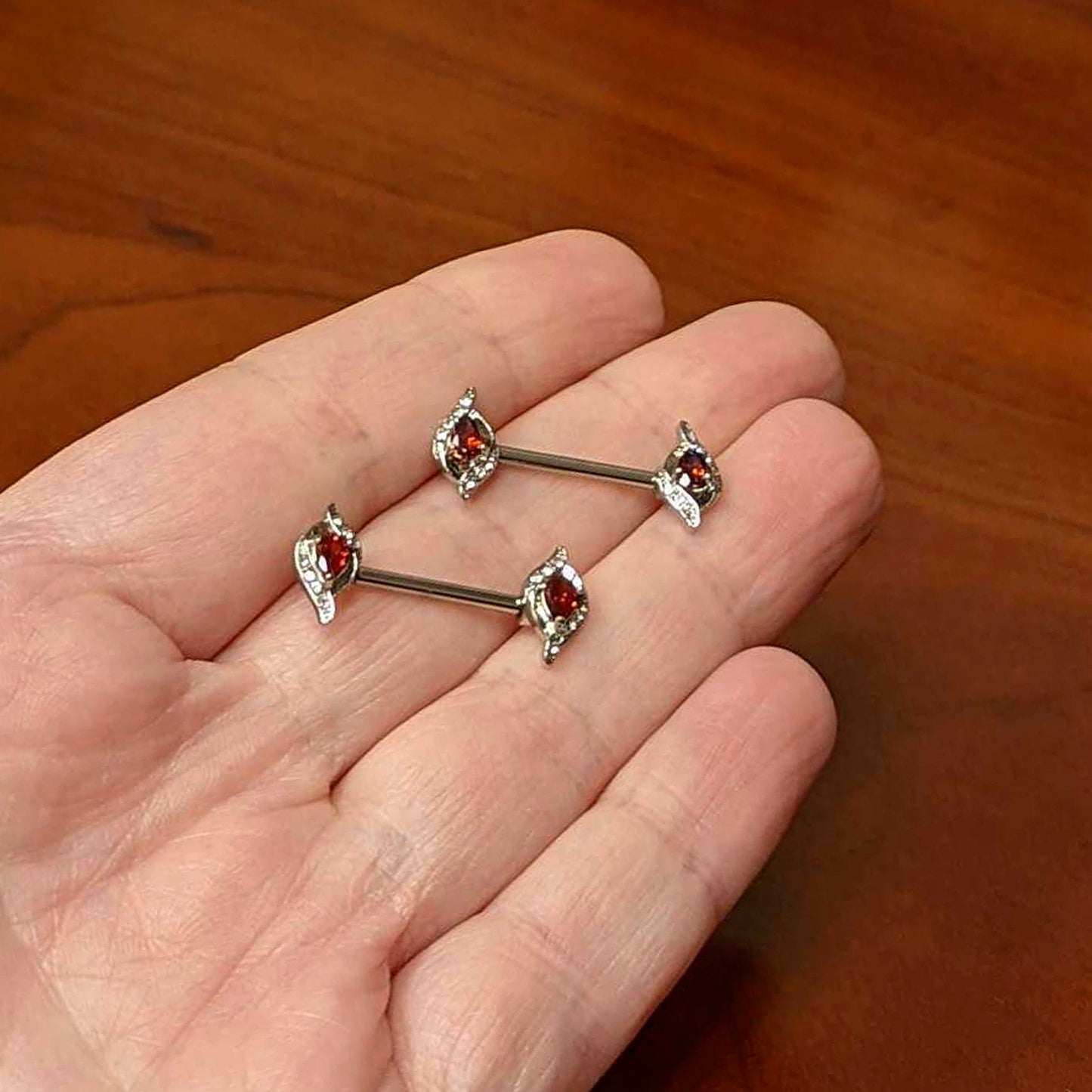 14 Gauge 9/16 Clear Red Gem Swirling Oval Barbell Nipple Ring Set