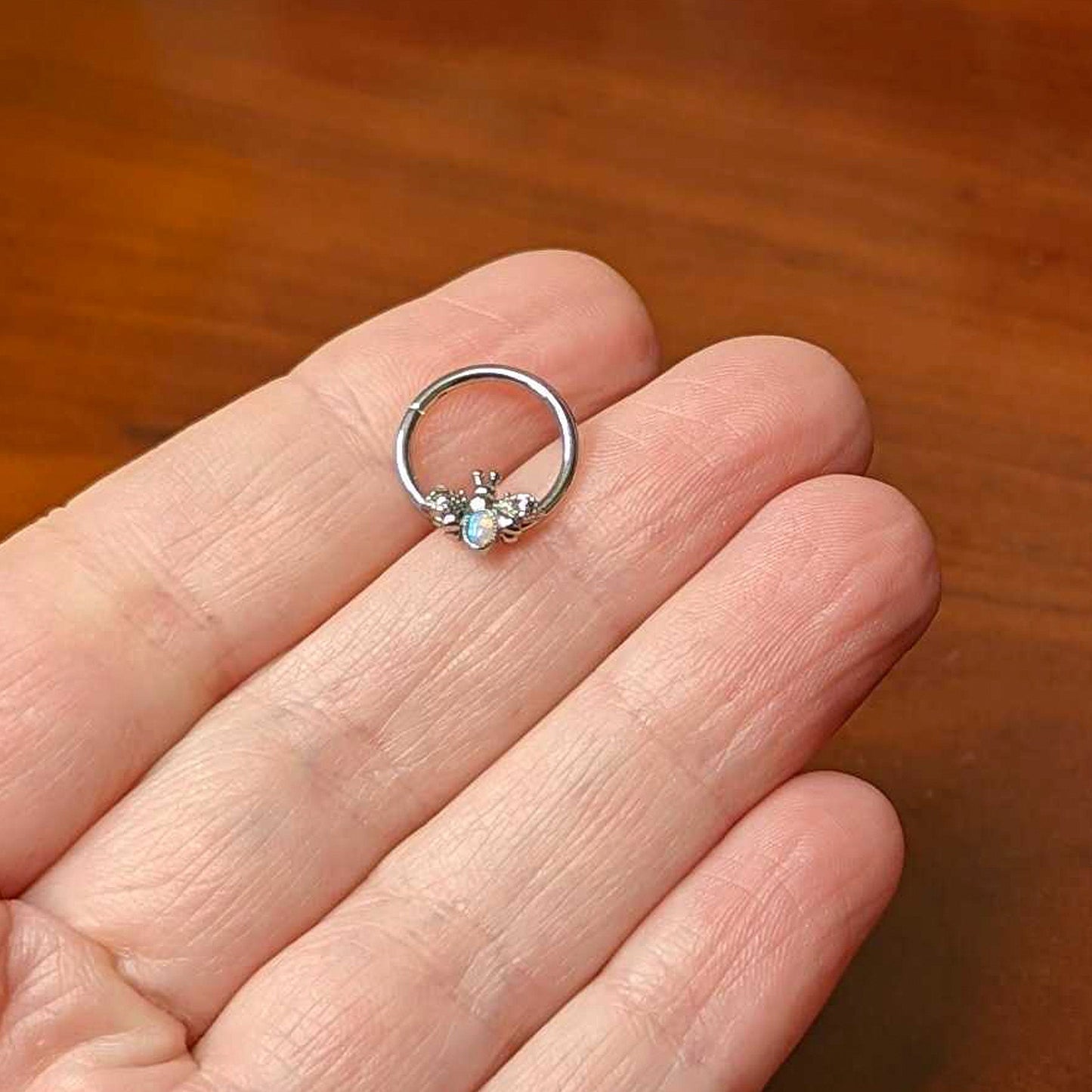 16 Gauge 3/8 White Synthetic Opal Insect Hinged Segment Ring