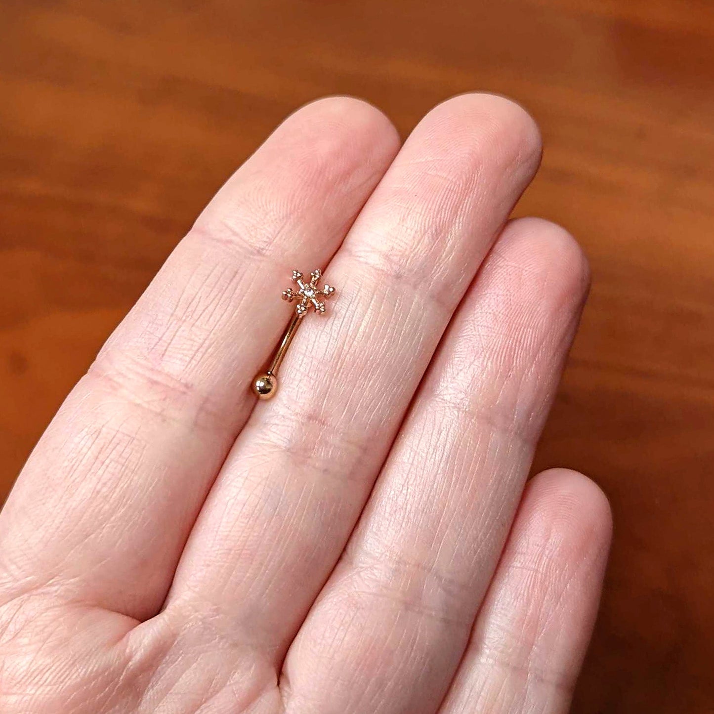 16 Gauge 5/16 Clear Gem Rose Gold Tone Snowflake Curved Eyebrow Ring